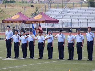 student cadets saluting