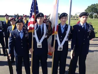 student color guard standing at attention